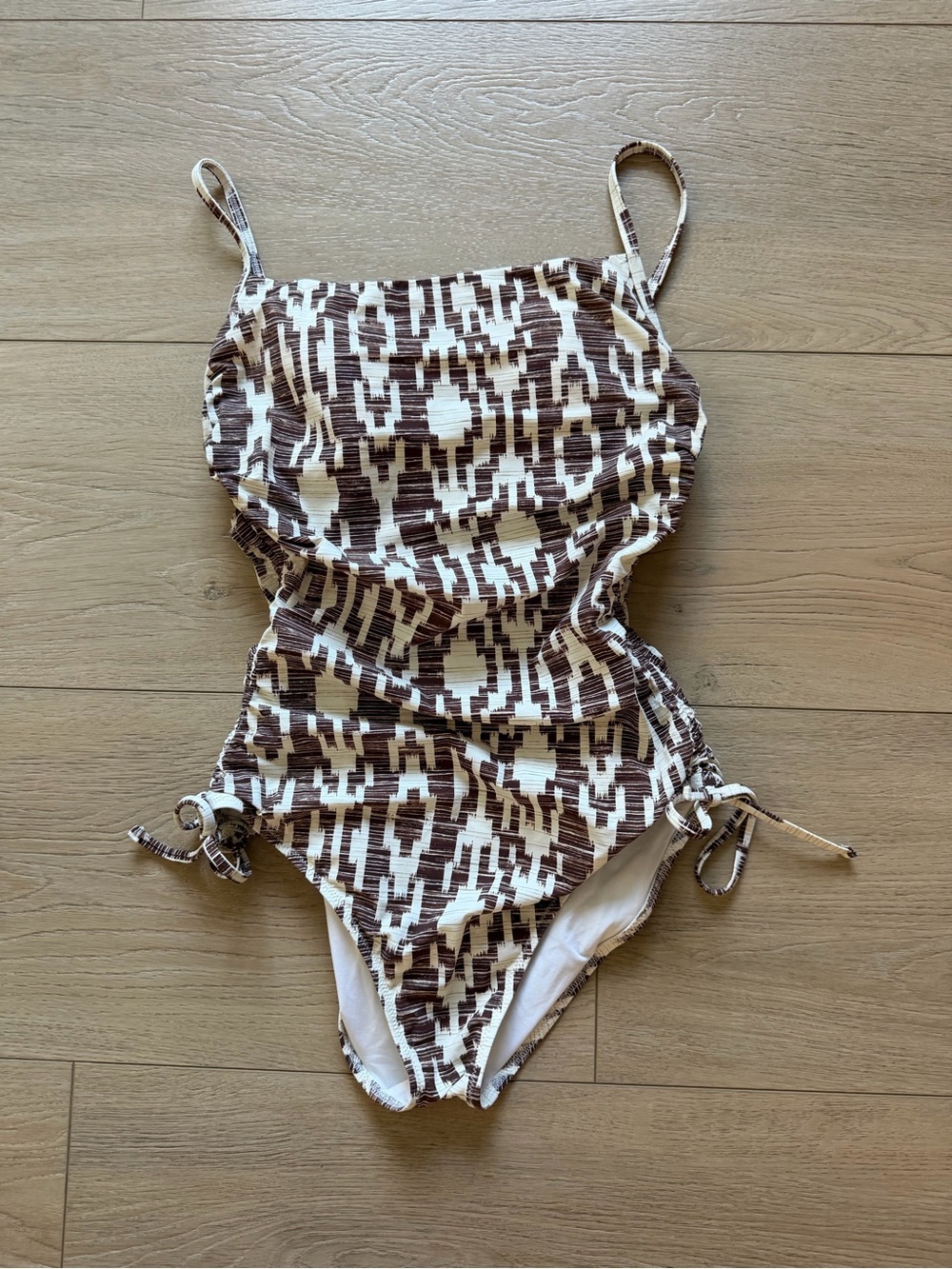Women’s Brown and White Patterned One-Piece Swimsuit, size 8. Adjustable leg